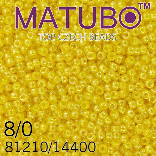 Korálky MATUBO™ mačkané rokajlové korálky. Velikost 8/0 (3,1mm). Barva 81210/14400 AMBER+BÍLÝ LISTR. Balení 10g.